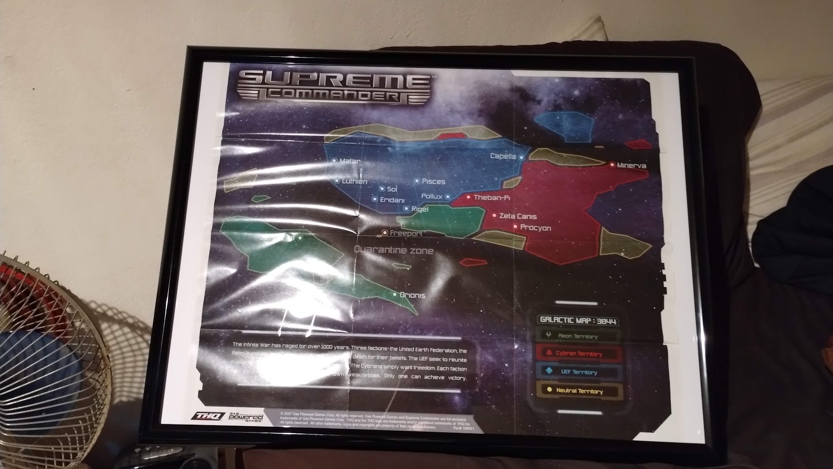 A galaxy map in a plain black frame with the logo for Supreme Commander in the corner.